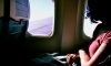 Woman on a plane looking out window